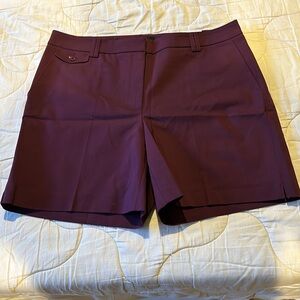 White House Black Market plum color shorts. 7 inch size 14 brand new with tags.